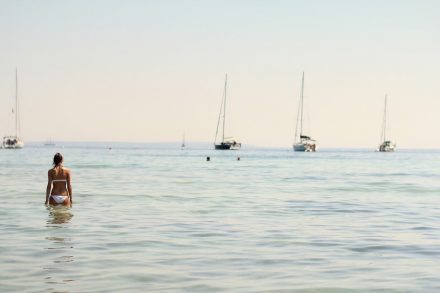 Girl in white bikini in Ibiza sea