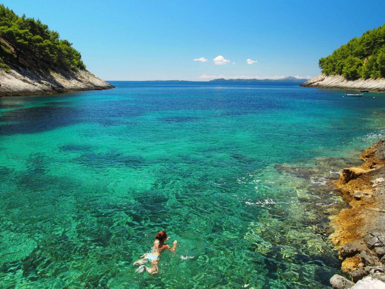 Girl swimming on the Croatian island of Korcula