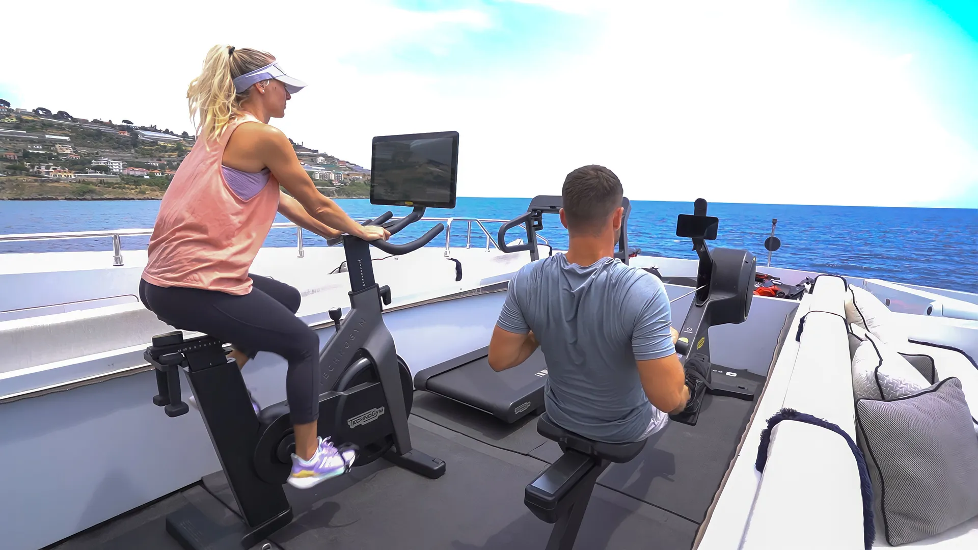 OKKO yacht gym equipment with couple working out
