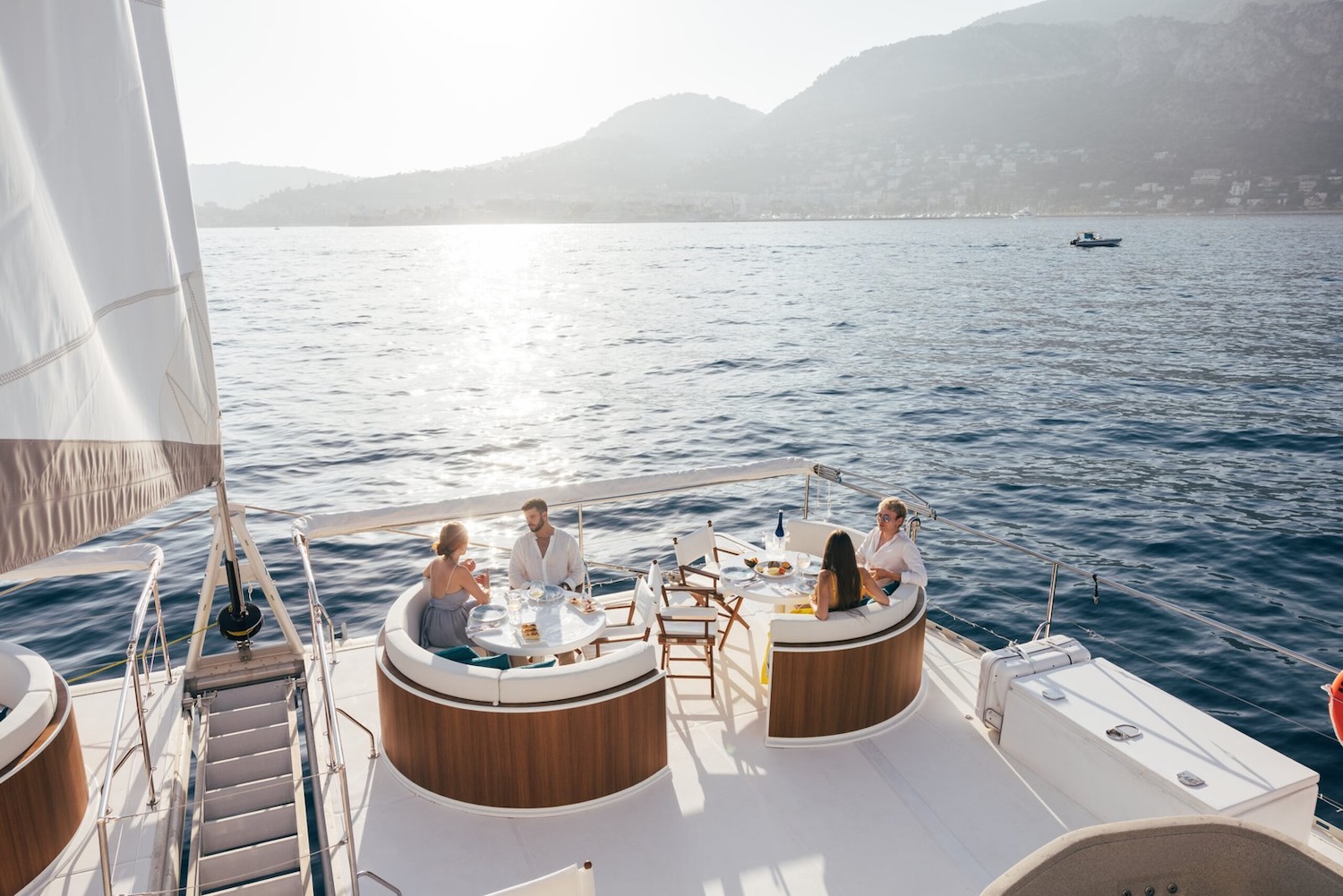 Two couples sitting on the yacht