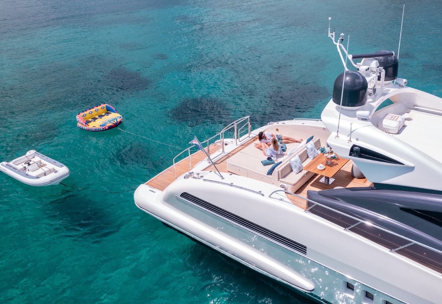 The yacht with the tender and an inflatable toy