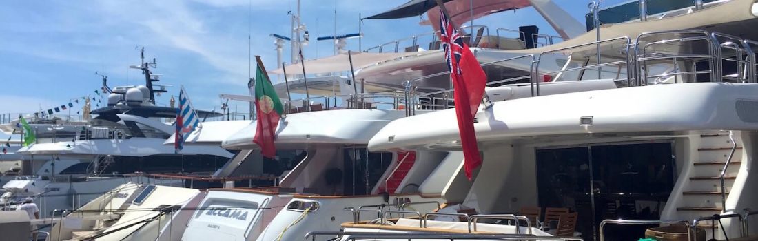 Gangways to luxury yachts line Cannes port