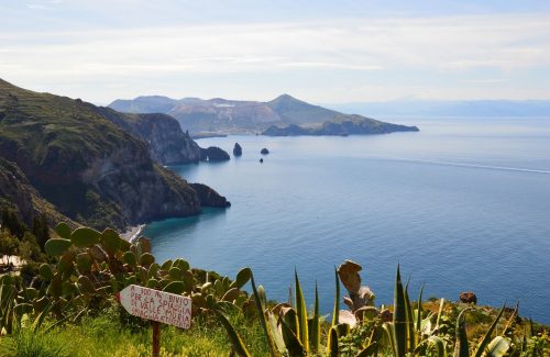 Sign post along coast path high above the blue seas of Lipari below