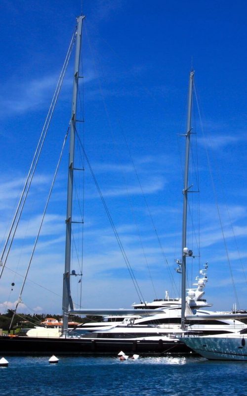 Two yachts alongside each other in Port Cervo