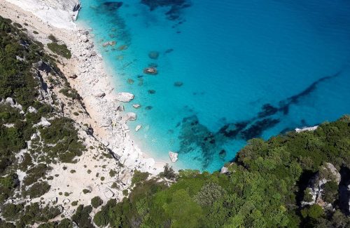 Crystal sea along rocky beach in Sardinia